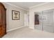 Bedroom featuring mirrored closet doors, neutral color palette and an open doorway at 1304 Fantastic Ct, North Las Vegas, NV 89081
