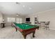 Enjoy a game of pool in this expansive game room featuring a seamless flow into the main living area at 1304 Fantastic Ct, North Las Vegas, NV 89081