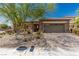 Single-story home with low maintenance desert landscaping and a brick paved driveway at 1304 Fantastic Ct, North Las Vegas, NV 89081