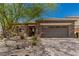 Beautiful single-story home with a stone facade and well-maintained desert landscaping at 1304 Fantastic Ct, North Las Vegas, NV 89081
