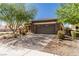 Single-story home with desert landscaping and a brick paved driveway at 1304 Fantastic Ct, North Las Vegas, NV 89081