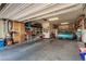 Spacious garage featuring built-in storage cabinets and a well-maintained classic blue car at 1304 Fantastic Ct, North Las Vegas, NV 89081