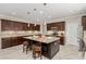 Spacious kitchen with island, granite counters, stainless appliances and stylish pendant lighting at 1304 Fantastic Ct, North Las Vegas, NV 89081