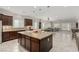 Open-concept kitchen boasts an island, stainless steel appliances, and granite countertops at 1304 Fantastic Ct, North Las Vegas, NV 89081