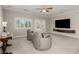 Bright living room with comfortable seating, a modern media center, and outdoor views at 1304 Fantastic Ct, North Las Vegas, NV 89081