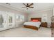 Spacious primary bedroom with french doors, large windows, and a ceiling fan at 1304 Fantastic Ct, North Las Vegas, NV 89081