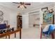 Bright office featuring two entrances, built-in bookcase, ceiling fan and vintage decor at 1304 Fantastic Ct, North Las Vegas, NV 89081