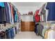 Organized walk-in closet featuring custom shelving, ample hanging space, and built-in drawers at 1304 Fantastic Ct, North Las Vegas, NV 89081