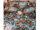 Breathtaking aerial view of a resort's pool complex with winding pools, lush landscaping, and inviting lounging areas at 135 E Harmon Ave # 2702, Las Vegas, NV 89109