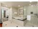 This spacious bathroom features a tub, shower and white tile at 135 E Harmon Ave # 2702, Las Vegas, NV 89109