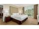 Spacious bedroom featuring a large bed, bedside tables, and a scenic view from the window at 135 E Harmon Ave # 2702, Las Vegas, NV 89109