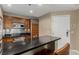Stylish kitchen with stainless steel appliances, a black countertop, and a breakfast bar at 135 E Harmon Ave # 2702, Las Vegas, NV 89109