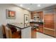 Modern kitchen with stainless steel appliances, a black countertop, and an inviting breakfast bar at 135 E Harmon Ave # 2702, Las Vegas, NV 89109