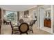 Inviting living room with comfortable seating, a glass-top table, and views of the nearby palm trees at 135 E Harmon Ave # 2702, Las Vegas, NV 89109
