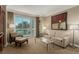 Bright and inviting living room with contemporary furnishings and a picturesque balcony view of palm trees at 135 E Harmon Ave # 2702, Las Vegas, NV 89109