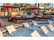 Relaxing pool area with lounge chairs in the water and cozy daybeds under vibrant umbrellas at 135 E Harmon Ave # 2702, Las Vegas, NV 89109