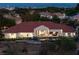 Gorgeous aerial view showcasing the backyard oasis with a pool and outdoor living spaces at 1429 Iron Hills Ln, Las Vegas, NV 89134