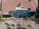 An aerial view shows desert landscaping surrounding a home with a pool and outdoor seating area at 1429 Iron Hills Ln, Las Vegas, NV 89134