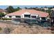 A beautiful aerial view shows the desert landscaping, sparkling pool and outdoor living space at 1429 Iron Hills Ln, Las Vegas, NV 89134