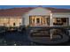 Backyard featuring a covered patio, a fountain, and multiple entry points to the house at 1429 Iron Hills Ln, Las Vegas, NV 89134