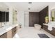 Modern bathroom features double vanity, soaking tub, and glass shower at 1429 Iron Hills Ln, Las Vegas, NV 89134