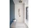 Modern bathroom with brass hardware, custom tile, and a glass shower at 1429 Iron Hills Ln, Las Vegas, NV 89134
