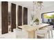 Dining room with a modern table, chairs, and lighting fixture at 1429 Iron Hills Ln, Las Vegas, NV 89134