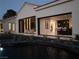 An inviting home exterior with a seamlessly connected interior and a tranquil water feature at 1429 Iron Hills Ln, Las Vegas, NV 89134