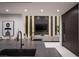 Modern kitchen featuring a large island and connection to the living room at 1429 Iron Hills Ln, Las Vegas, NV 89134