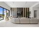 Open living room with large windows, sleek fireplace, and contemporary furnishings create an inviting space at 1429 Iron Hills Ln, Las Vegas, NV 89134