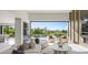 Bright open living room featuring modern furnishings and expansive views of the golf course at 1429 Iron Hills Ln, Las Vegas, NV 89134