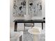A close-up of the office reveals a black desk, art, and a table with books at 1429 Iron Hills Ln, Las Vegas, NV 89134