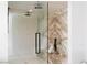 Large glass shower with marble style walls and dual shower heads at 1429 Iron Hills Ln, Las Vegas, NV 89134