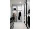 Custom closet with black and white design and built-in storage at 1429 Iron Hills Ln, Las Vegas, NV 89134