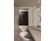 Close-up of a climate controlled wine storage unit adjacent to dining room at 1429 Iron Hills Ln, Las Vegas, NV 89134