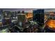 Breathtaking aerial view of the city skyline featuring multiple high rise residences and surrounding establishments at dusk at 145 E Harmon Ave # 3705, Las Vegas, NV 89109