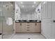 Spacious bathroom featuring dual sinks, a glass-enclosed shower, and modern fixtures at 145 E Harmon Ave # 3705, Las Vegas, NV 89109