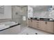 Bathroom with a soaking tub, a glass-enclosed shower, and dual sinks at 145 E Harmon Ave # 3705, Las Vegas, NV 89109