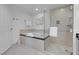 Bathroom with a deep soaking tub and a separate glass-enclosed shower with modern fixtures at 145 E Harmon Ave # 3705, Las Vegas, NV 89109