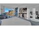Inviting living room features a comfortable seating area, a kitchenette, and expansive views from the large window at 145 E Harmon Ave # 3705, Las Vegas, NV 89109