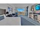 Inviting living room boasts expansive views from the large window, comfortable seating, and a kitchenette at 145 E Harmon Ave # 3705, Las Vegas, NV 89109