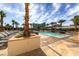 Resort-style pool with lounge chairs and palm trees, creating a perfect oasis for relaxing and soaking up the sun at 145 E Harmon Ave # 3705, Las Vegas, NV 89109