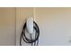 Tesla electric car charger mounted on the side of the home at 145 Forest Crossing Ct, Las Vegas, NV 89148