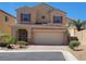 Charming two-story home with a tile roof and well-manicured landscaping showcasing curb appeal at 145 Forest Crossing Ct, Las Vegas, NV 89148