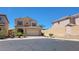 Two-story home with brick accents, well-manicured lawn, and two car garage at 145 Forest Crossing Ct, Las Vegas, NV 89148