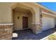 Inviting front porch features stone accents, providing a warm and welcoming entrance to the home at 145 Forest Crossing Ct, Las Vegas, NV 89148