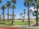 Picturesque golf course with many palm trees and blue skies at 145 Forest Crossing Ct, Las Vegas, NV 89148