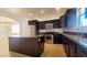 Well-equipped kitchen featuring a large island, stainless steel appliances, and dark cabinetry at 145 Forest Crossing Ct, Las Vegas, NV 89148