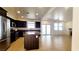 Spacious kitchen with stainless steel appliances, a center island, and an open layout connecting to the living area at 145 Forest Crossing Ct, Las Vegas, NV 89148