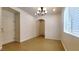 Bright living room with tile flooring, natural light, and an open archway creating a spacious atmosphere at 145 Forest Crossing Ct, Las Vegas, NV 89148